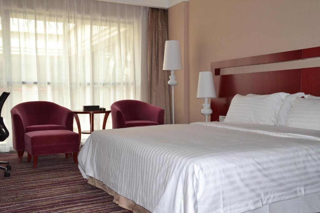 Elite Garden Hotel Янгшуо Стая снимка